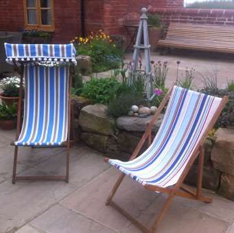 Recovered Deck Chairs one with canopy and bobble fringe